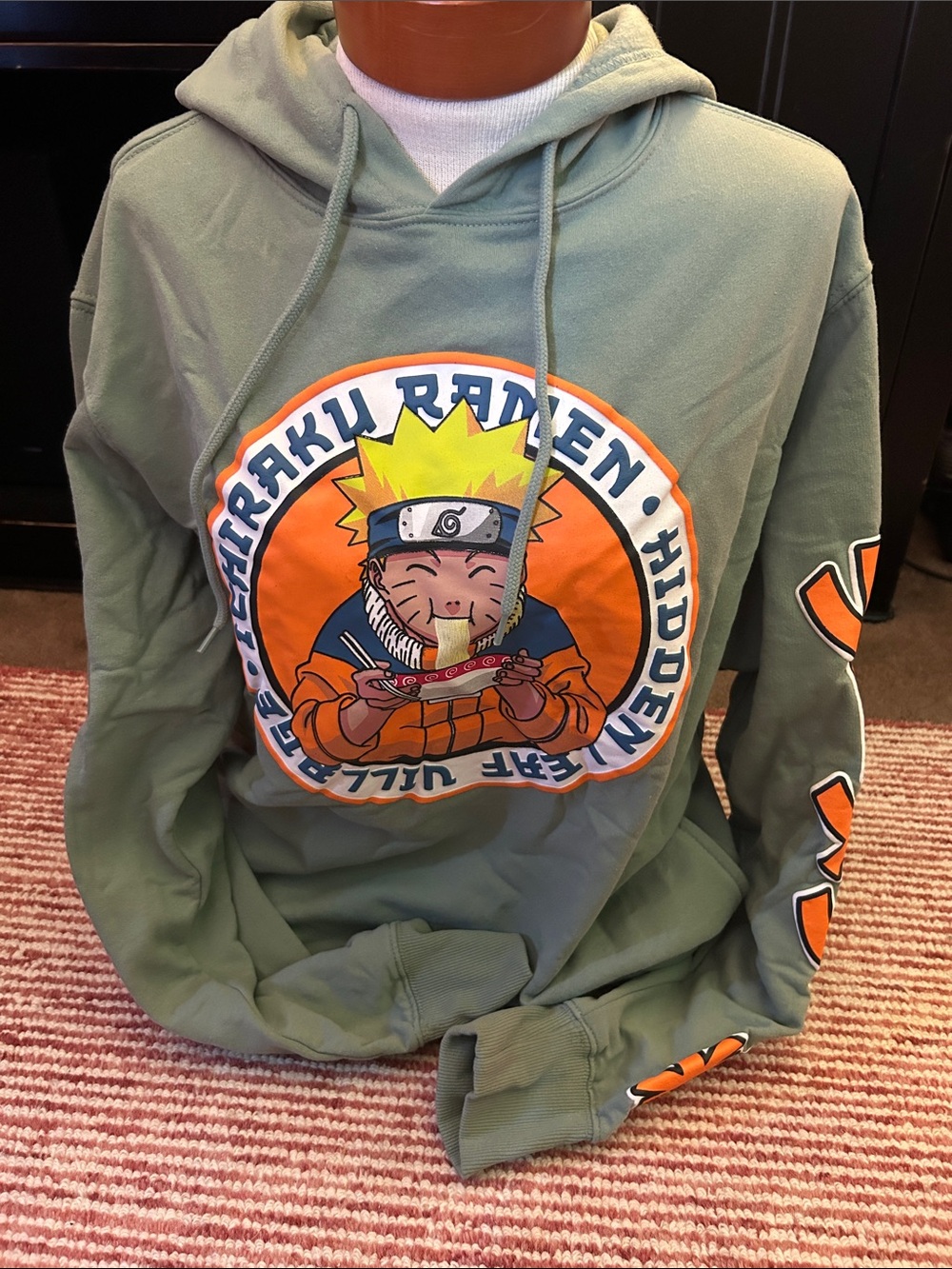 Olive Green Anime Graphic Hoodie with Orange Accents